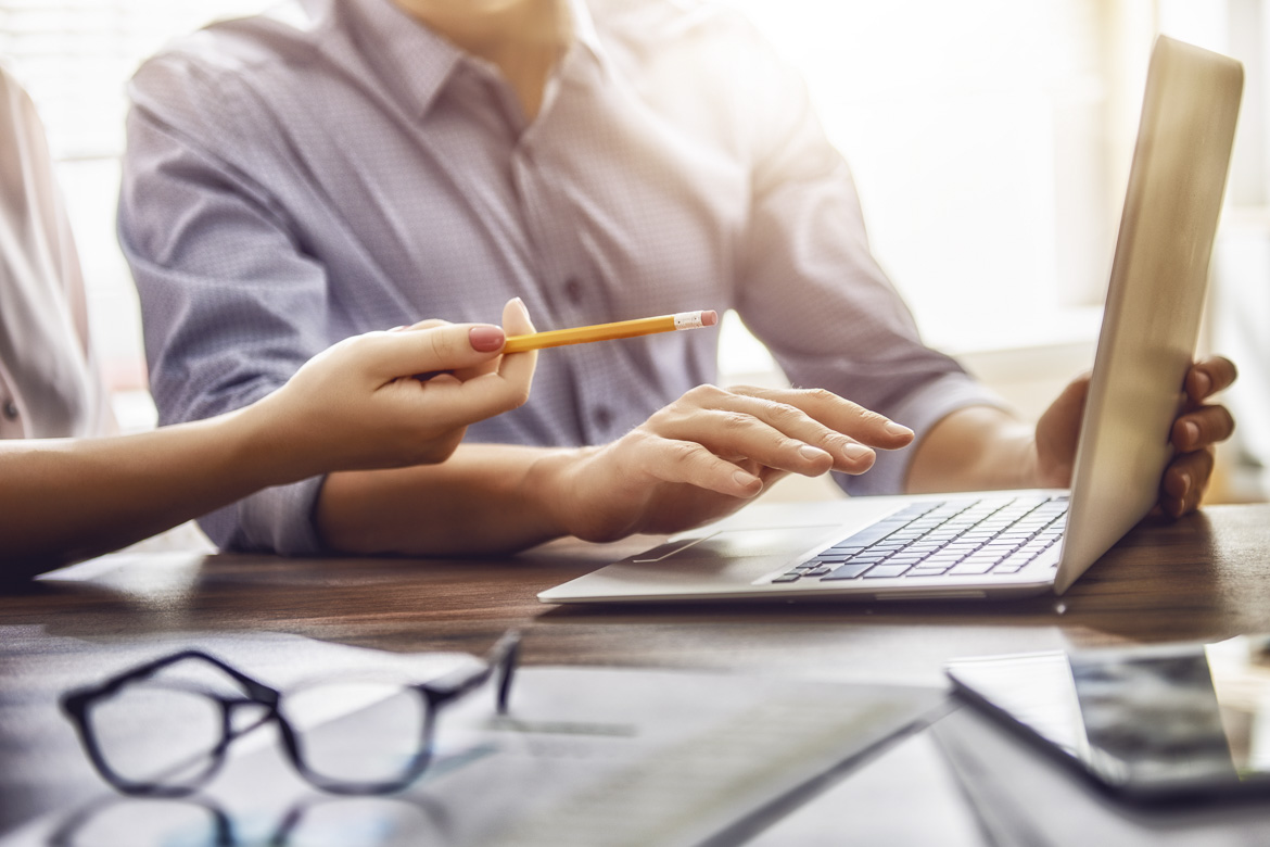 man and woman working in the office